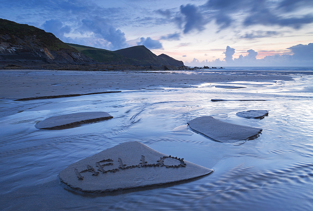 A welcome message left in the sand on Crackington Haven Beach, Cornwall, England, United Kingdom, Europe 