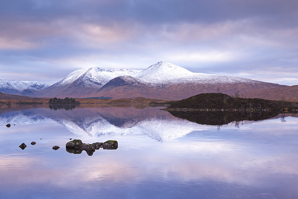 Snow covered Black Mount reflected in a lochan, Rannoch Moor, Highlands, Scotland, United Kingdom, Europe