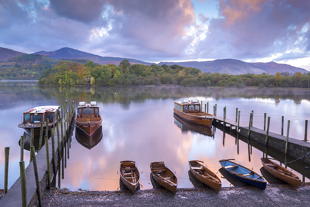 Boats moored on Derwent Water at dawn in autumn, Keswick, Lake District, Cumbria, England, United Kingdom, Europe