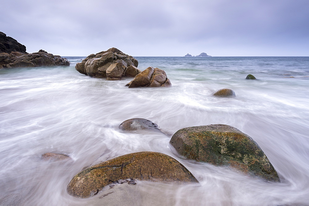 Waves wash over the beach at Porth Nanven near Land's End, Cornwall, England, United Kingdom, Europe