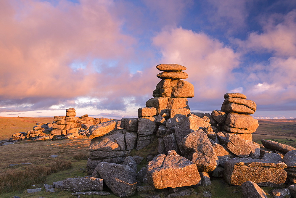 Rich evening sunlight illuminates Great Staple Tor at sunset, Dartmoor, Devon, England, United Kingdom, Europe