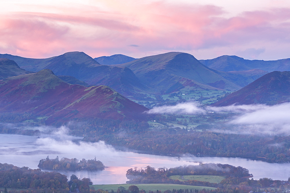 Misty autumn sunrise over Derwent Water and the Newlands Valley, Lake District National Park, Cumbria, England, United Kingdom, Europe