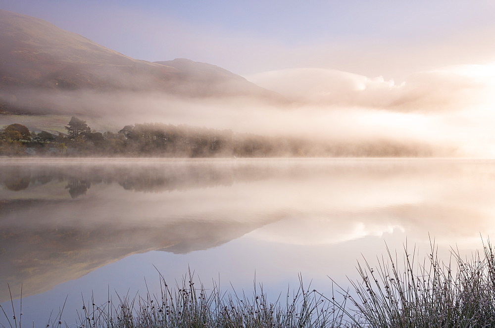 Misty morning over Loweswater in autumn in the Lake District National Park, Cumbria, England, United Kingdom, Europe