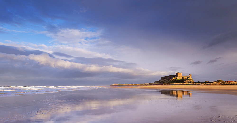 Bamburgh Castle and beautiful deserted beach in winter, Northumberland, England, United Kingdom, Europe