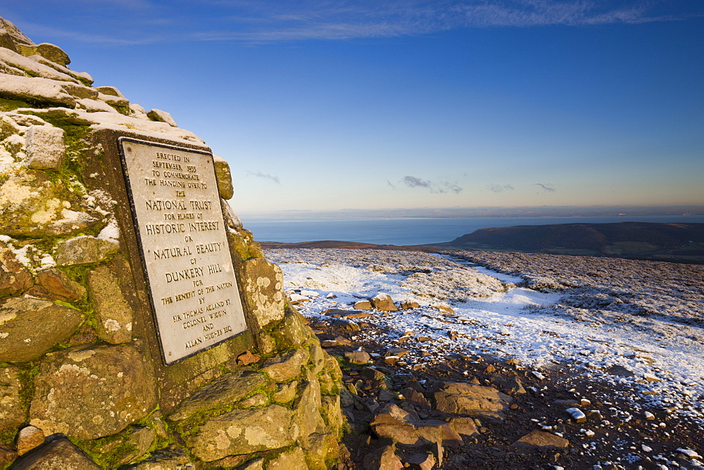 Stone cairn at Dunkery Beacon on a snowy winter morning, Exmoor National Park, Somerset, England, United Kingdom, Europe