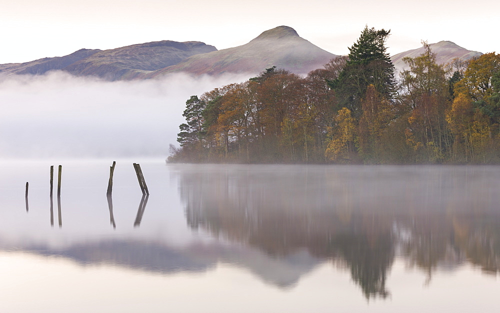 Early morning autumn mist over Derwent Water, Lake District National Park, Cumbria, England, United Kingdom, Europe