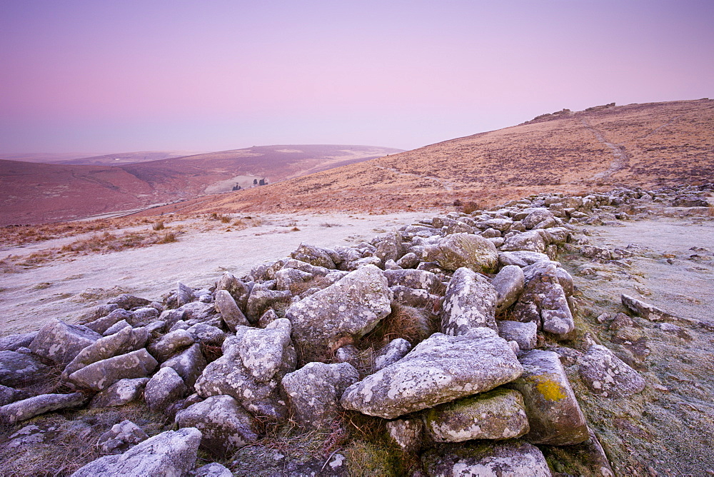 Frost coats the circular stone perimeter wall of the Bronze Age settlement of Grimspound in Dartmoor National Park, Devon, England, United Kingdom, Europe