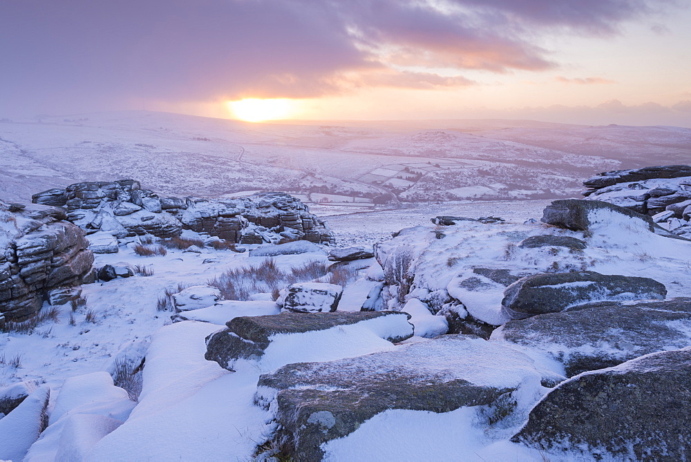 Snow covered rocky moorland at sunrise in winter, Great Staple Tor, Dartmoor National Park, Devon, England, United Kingdom, Europe