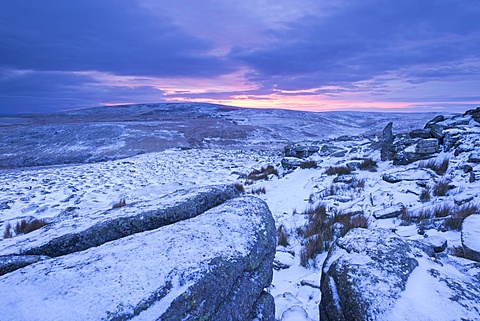 Sunrise above a snow covered moorland, Belstone Tor, Dartmoor National Park, Devon, England, United Kingdom, Europe