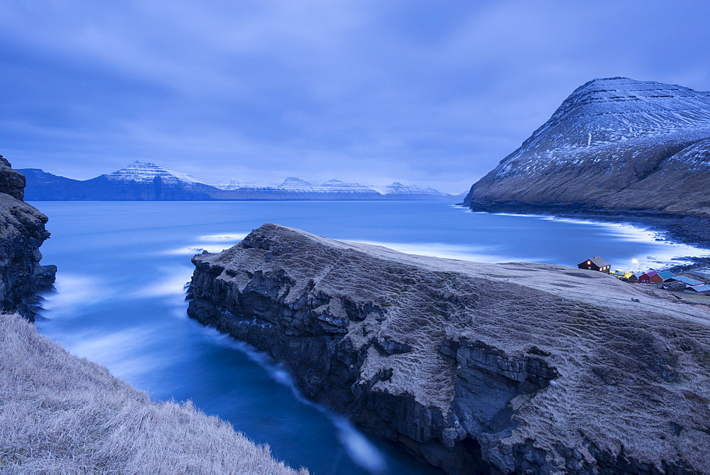 Night time descends over Gjogv on the island of Eysturoy, Faroe Islands, Denmark, Europe