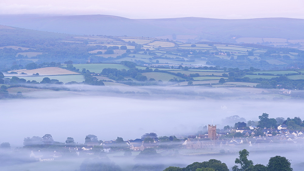 Moretonhampstead town and church at dawn on a misty morning, Dartmoor National Park, Devon, England, United Kingdom, Europe