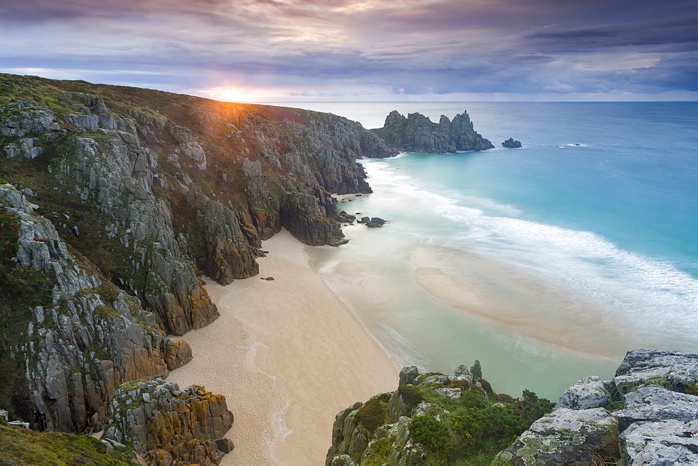 Sunrise over Pednvounder Beach at the Logan Rock, Cornwall, England, United Kingdom, Europe