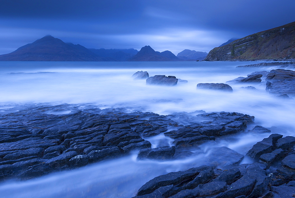 Twilight on the rocky coast of Elgol, looking across to the Cuillin mountains, Isle of Skye, Inner Hebrides, Scotland, United Kingdom, Europe