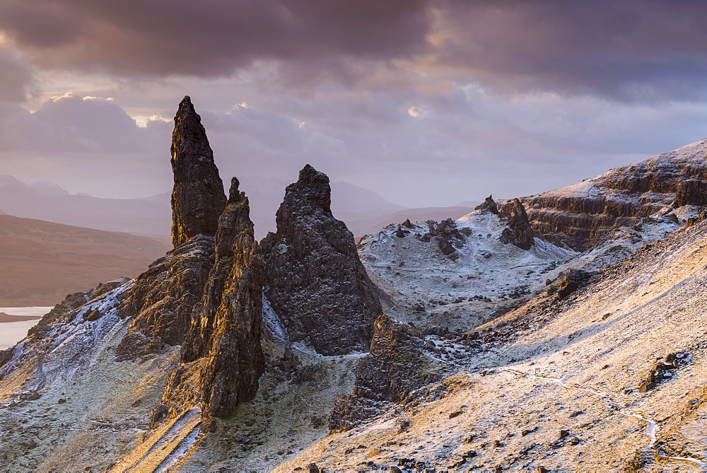 Snow dusted Old Man of Storr at sunrise, Isle of Skye, Inner Hebrides, Scotland, United Kingdom, Europe