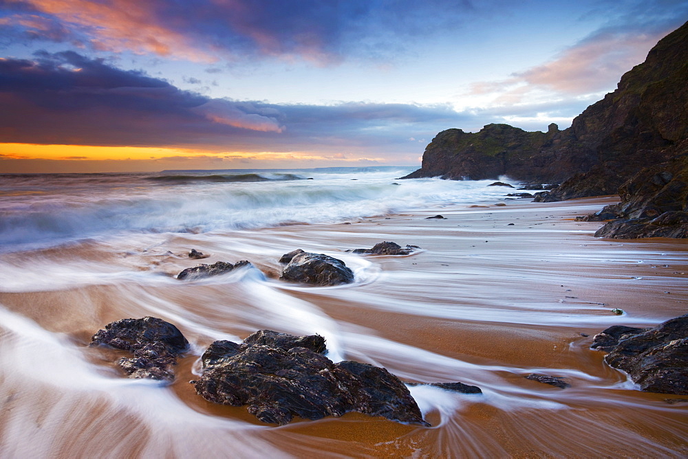 High tide water trails on Shippen beach at Hope Cove, South Hams, Devon, England, United Kingdom, Europe