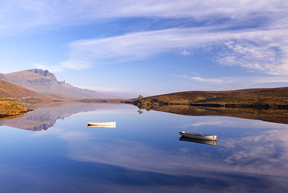 Rowing boats on Loch Fada, with the Old Man of Storr beyond, Isle of Skye, Inner Hebrides, Scotland, United Kingdom, Europe