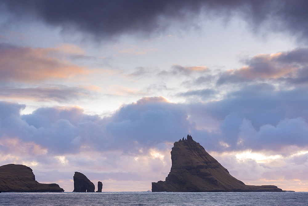 Dramatic outline of Tindholmur island at sunset, Vagar, Faroe Islands, Denmark, Europe