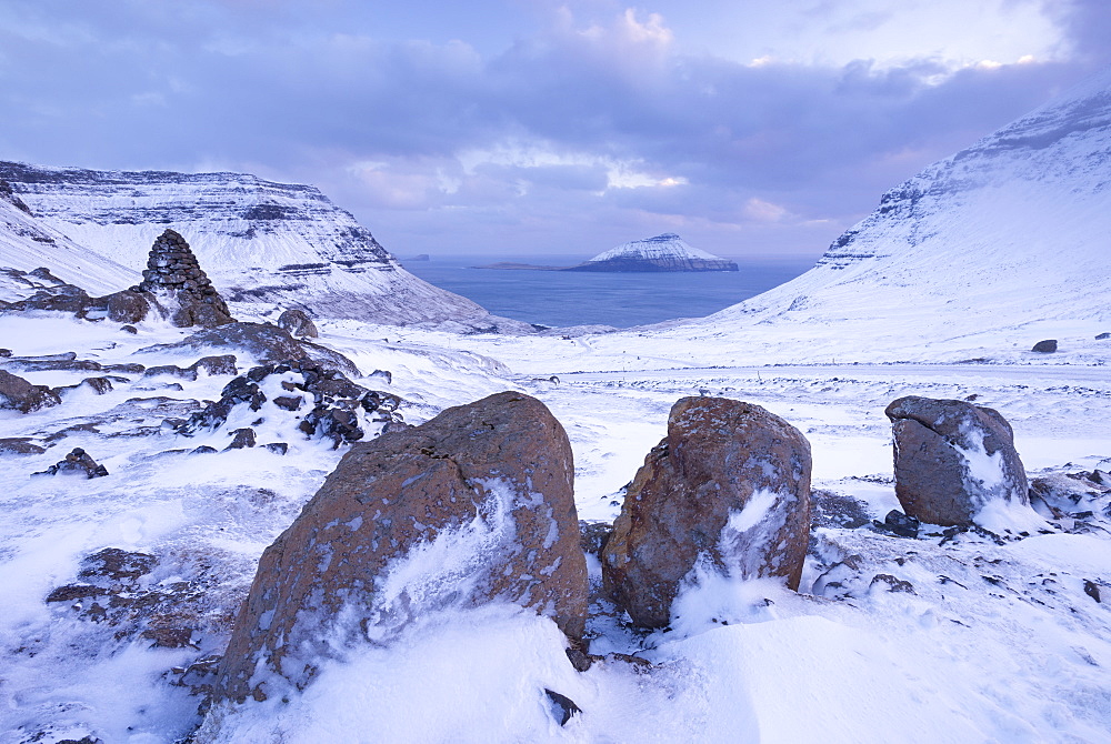 Snow covered Streymoy mountain landscape looking towards the island of Koltur, Streymoy, Faroe Islands, Denmark, Europe