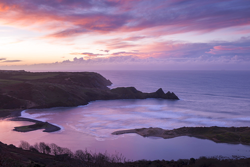 Beautiful dawn sky over Three Cliffs Bay in winter, Gower Peninsula, Wales, United Kingdom, Europe