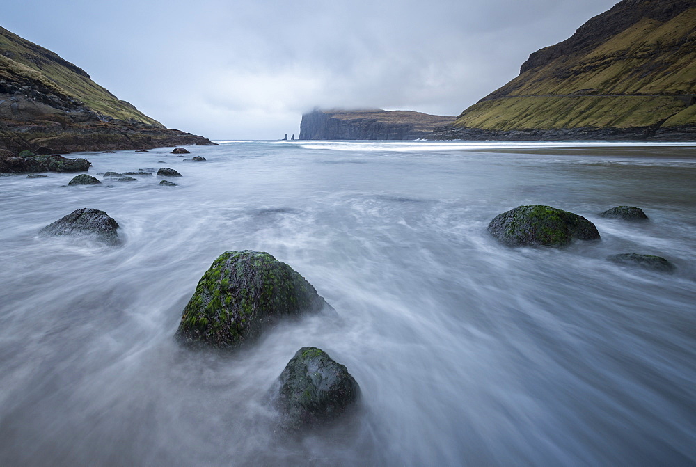 Risin and Kellingin sea stacks viewed from the shores of Tjornuvik on the island of Streymoy, Faroe Islands, Denmark, Europe