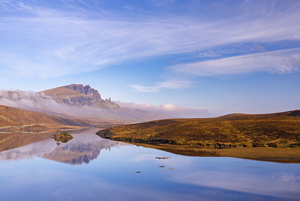 The Old Man of Storr reflected in a mirror still Loch Fada, Isle of Skye, Inner Hebrides, Scotland, United Kingdom, Europe