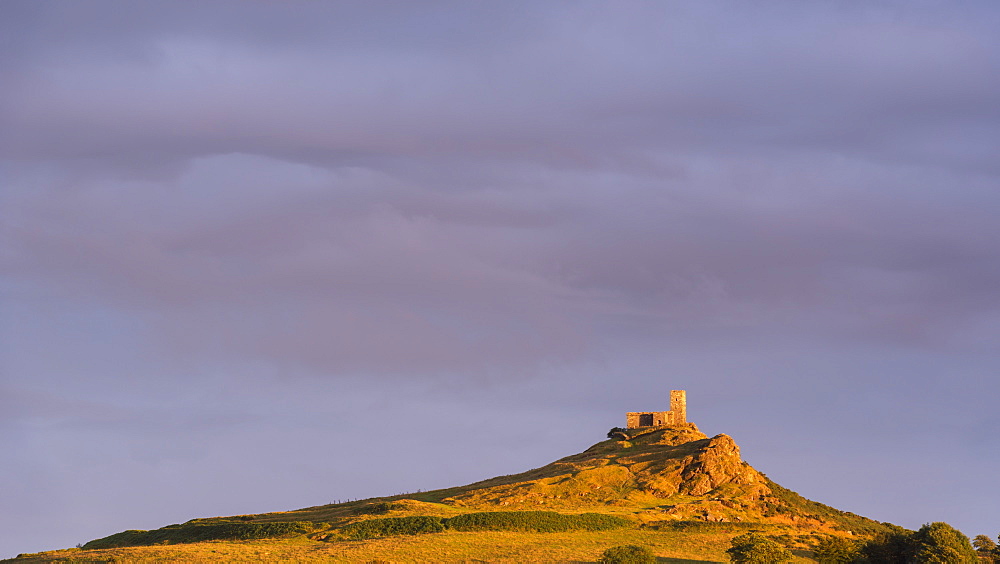 Brentor Church bathed in rich evening sunlight, Dartmoor National Park, Devon, England, United Kingdom, Europe