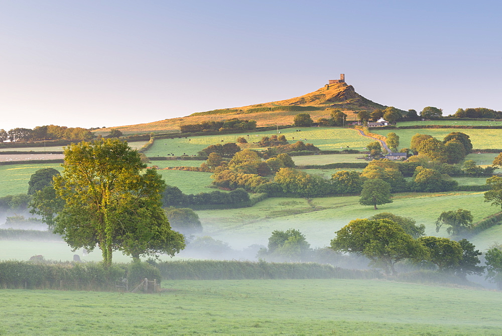 Early morning mist in the rolling farmland below Brentor at dawn, Dartmoor National Park, Devon, England, United Kingdom, Europe