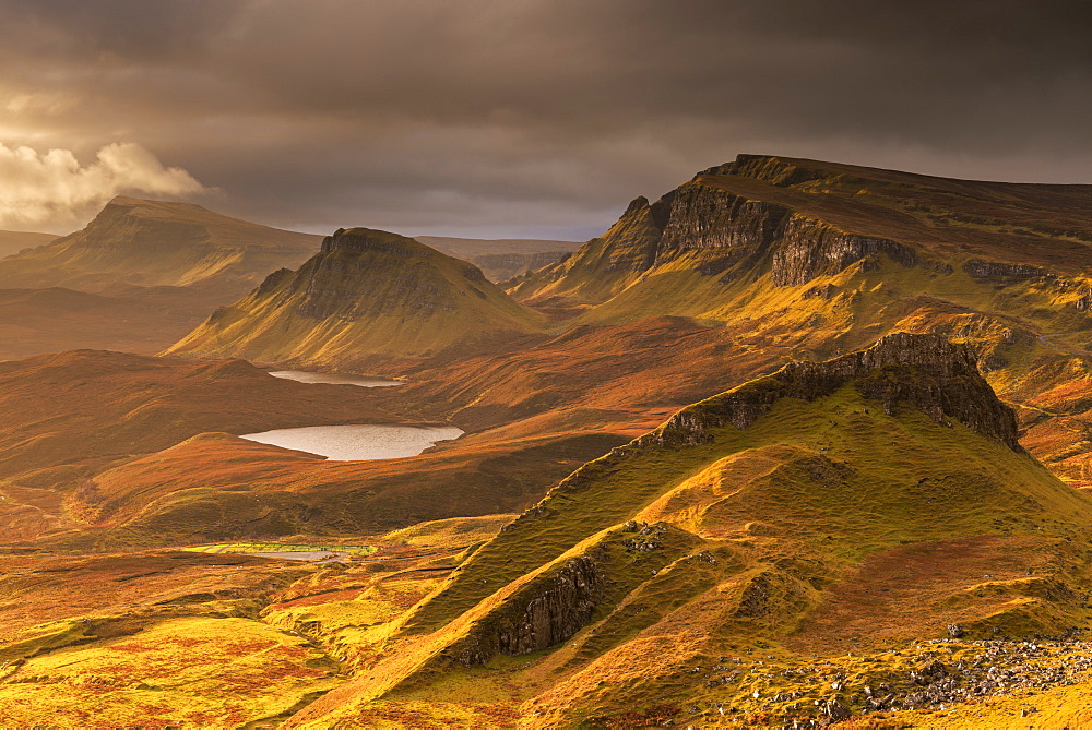 Dramatic light over the Trotternish mountain ridge from the Quiraing, Isle of Skye, Inner Hebrides, Scotland, United Kingdom, Europe