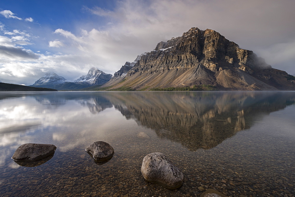 Crowfoot mountain reflection in the mirror still waters of Bow Lake, Banff National Park, UNESCO World Heritage Site, Alberta, Rocky Mountains, Canada, North America