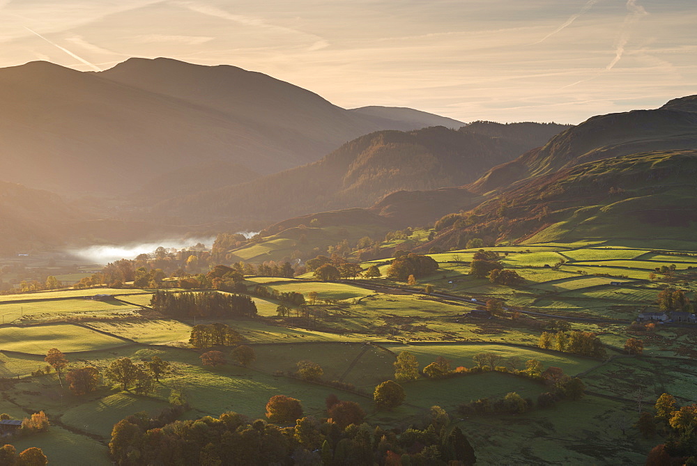 Sunlit rolling countryside near Keswick, Lake District National Park, Cumbria, England, United Kingdom, Europe