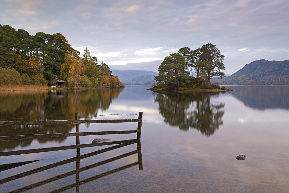 Mirror still reflections on Derwent Water in the Lake District National Park, Cumbria, England, United Kingdom, Europe