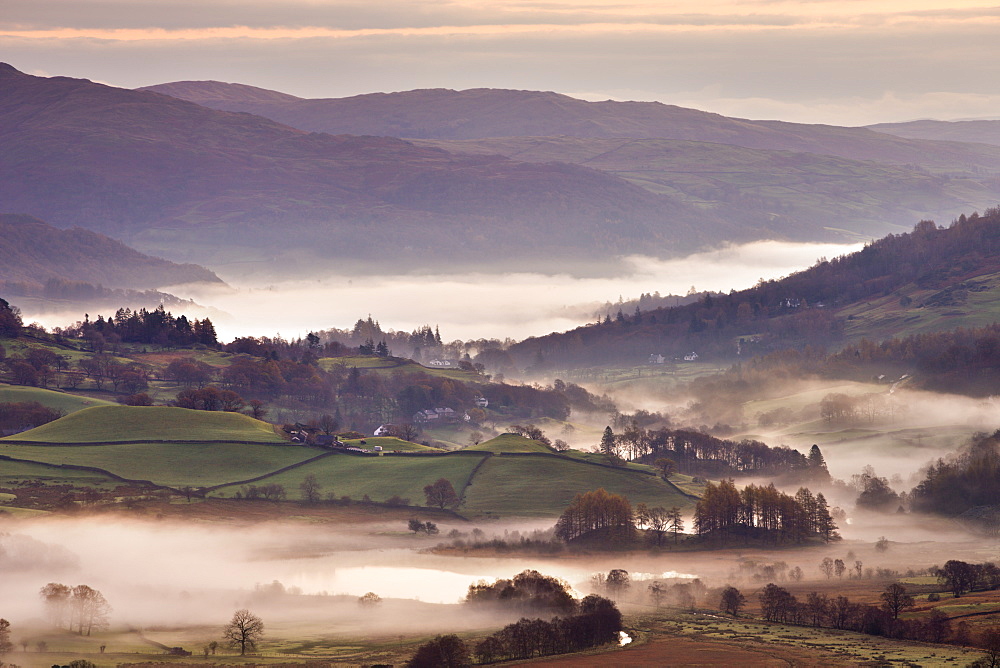 Little Langdale surrounded by mist at dawn in autumn, Lake District National Park, Cumbria, England, United Kingdom, Europe