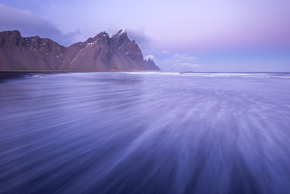 Pink pastel twilight on the shores of Vestrahorn in winter, Iceland, Polar Regions