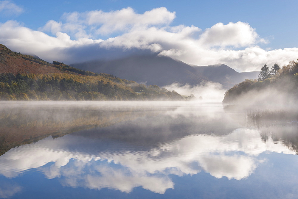 Morning mist and autumnal reflections at Loweswater in the Lake District National Park, Cumbria, England, United Kingdom, Europe