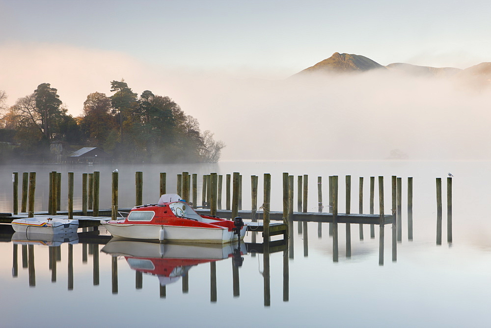 Tethered boats on Derwent Water on a misty autumn morning, Lake District National Park, Cumbria, England, United Kingdom, Europe