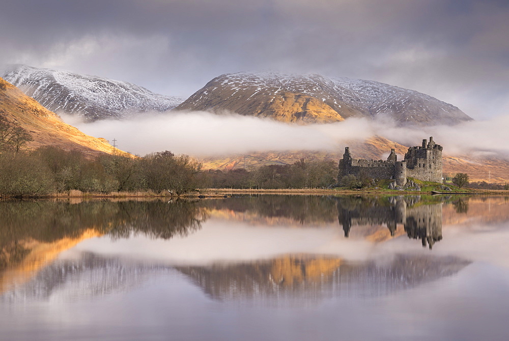 The abandoned ruin of Kilchurn Castle on a misty winter morning, Loch Awe, Argyll and Bute, Highlands, Scotland, United Kingdom, Europe