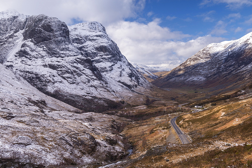 Looking down the pass of Glencoe with snow over the Three Sisters of Glencoe, Highland, Scotland, United Kingdom, Europe