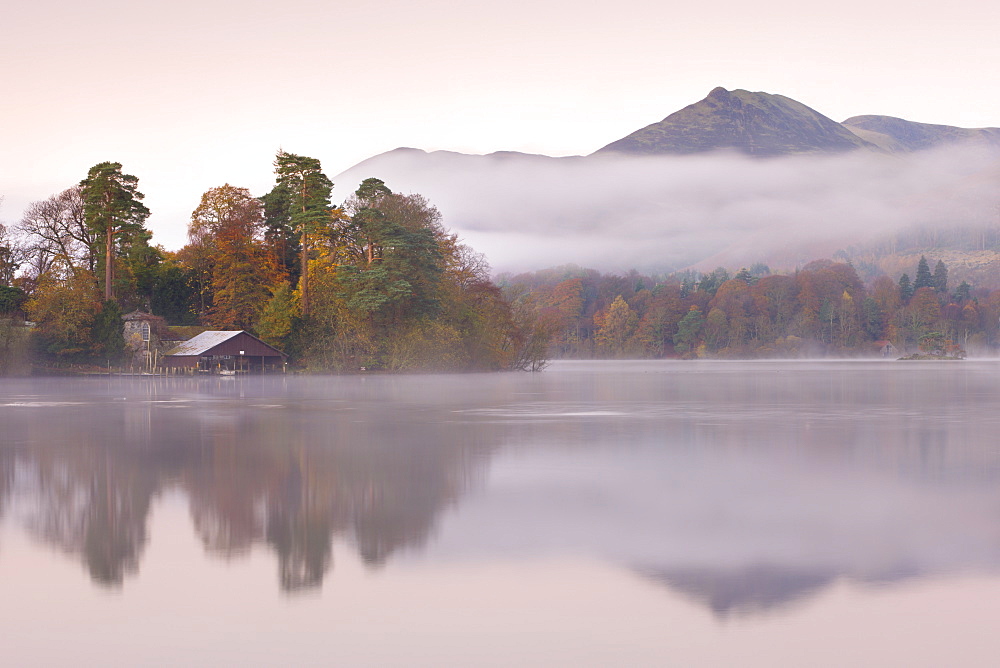 Boathouse on a misty Derwent Water in autumn, Lake District National Park, Cumbria, England, United Kingdom, Europe