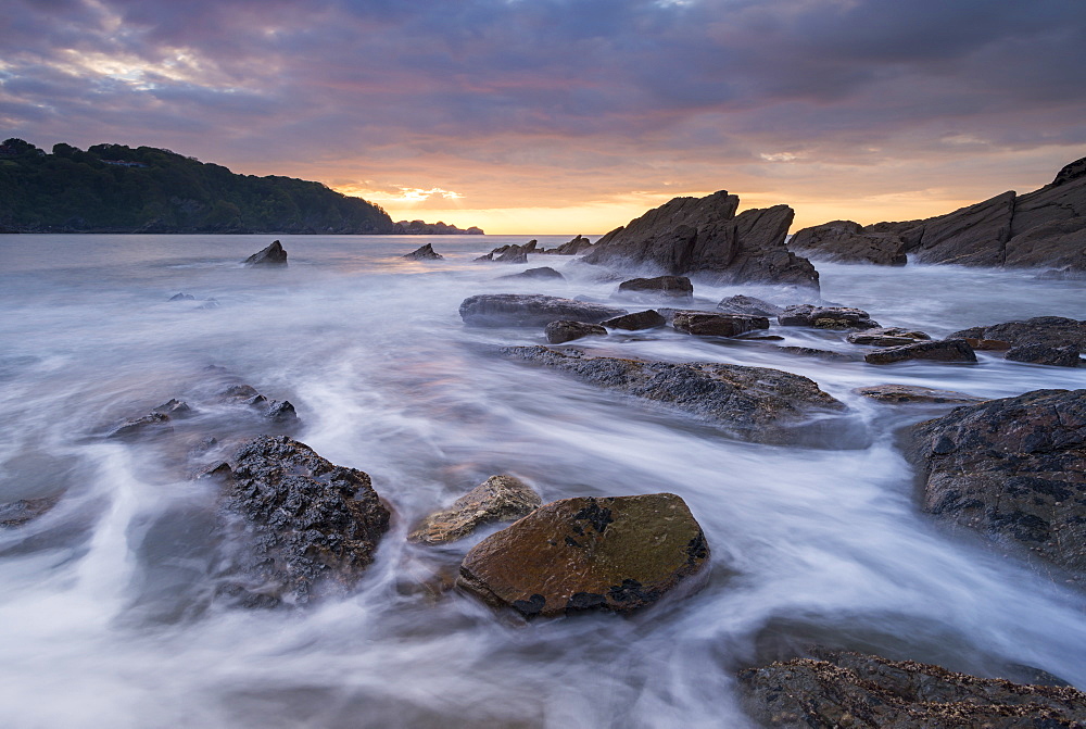 Sunset over the rocky shores of Combe Martin on the Exmoor coast, Devon, England, United Kingdom, Europe