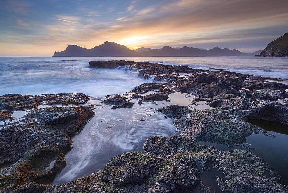 Sunrise over the dramatic coastal scenery of Gjogv in the Faroe Islands, Denmark, Europe