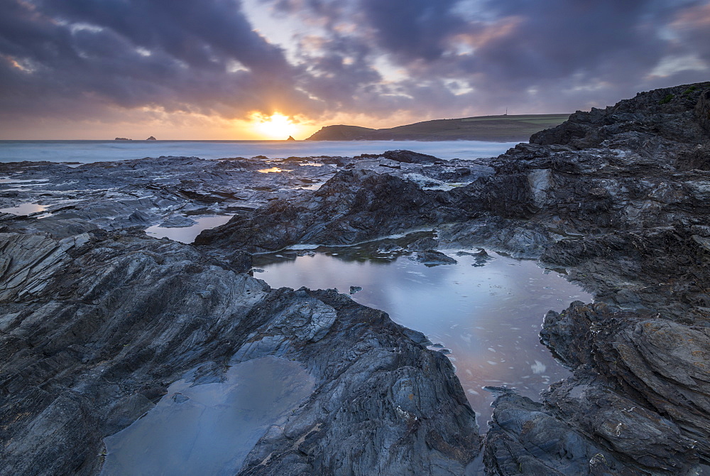 Sunset over Trevose Head, from the rocky shores of Booby's Bay, Cornwall, England, United Kingdom, Europe