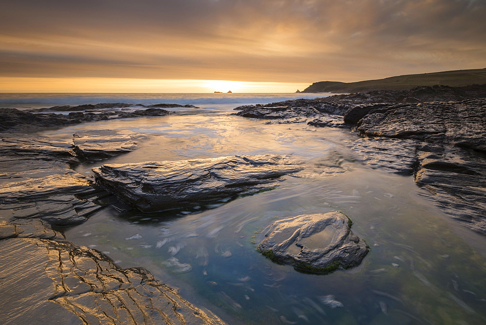 Spectacular golden sunset above the rocky shores of Boobys Bay near Trevose Head, Cornwall, England, United Kingdom, Europe