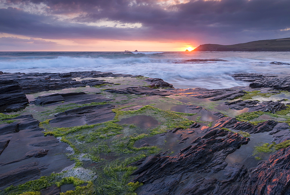 Sunset over Trevose Head from the rocky ledges of Booby's Bay, Cornwall, England, United Kingdom, Europe