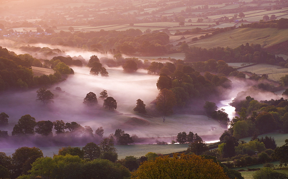 Mist lingers in the Usk Valley at dawn in autumn, Brecon Beacons National Park, Powys, Wales, United Kingdom, Europe