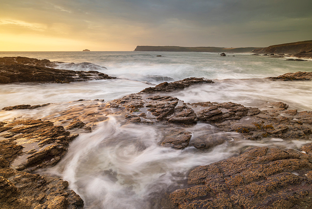 Waves surge over rock ledges on the North Cornish coast, Cornwall, England, United Kingdom, Europe