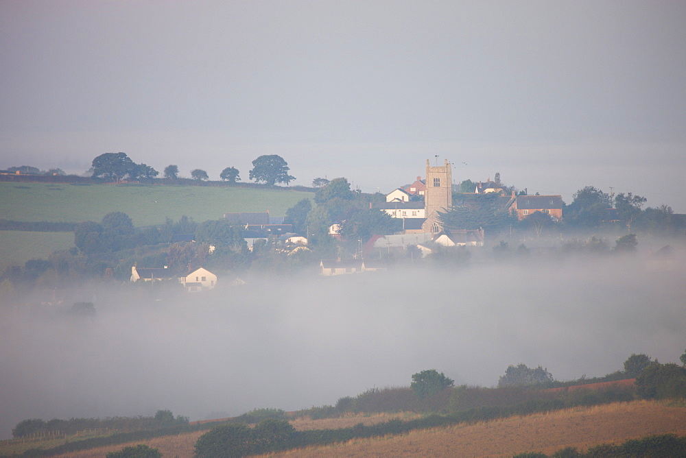 Colebrooke village and church surrounded by mist, Devon, England, United Kingdom, Europe