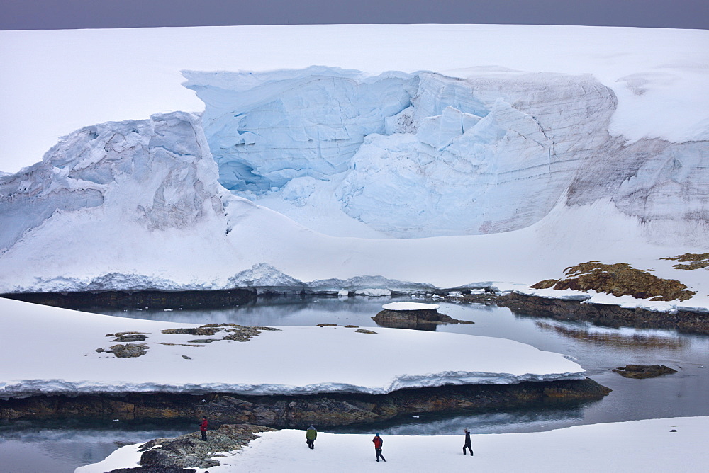 Tourists investigate a glacier face on White Island, Antarctic Peninsula, Antarctica, Polar Regions