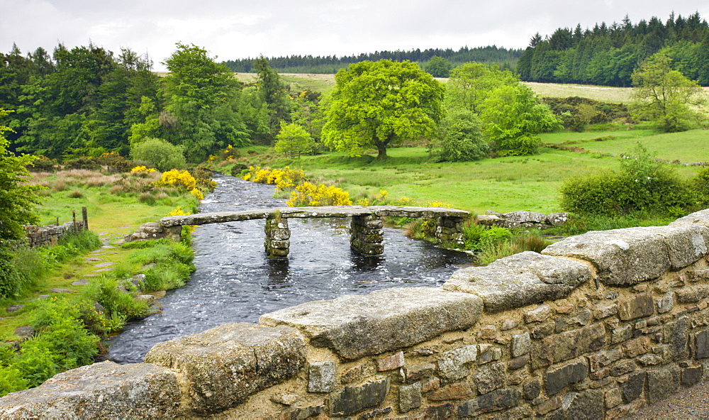 Ancient Clapper Bridge over the West Dart River at Two Bridges, Dartmoor National Park, Devon, England, United Kingdom, Europe