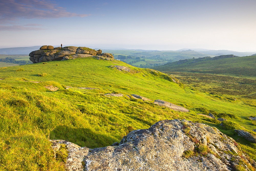 Man standing on Saddle Tor, Dartmoor National Park, Devon, England, United Kingdom, Europe