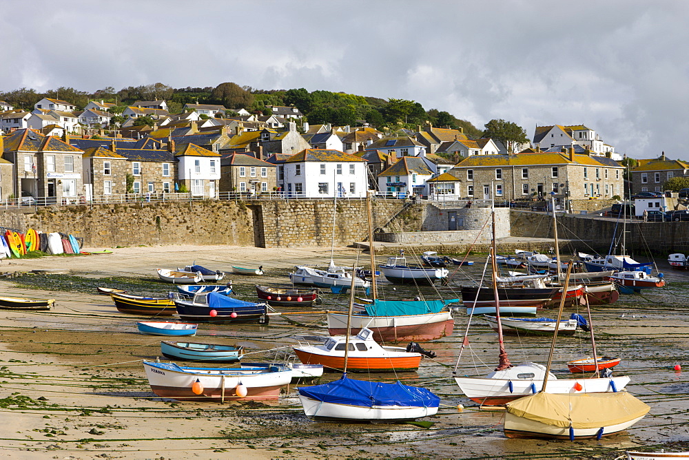 Views over Mousehole village and harbour at low tide, Mousehole, Cornwall, England, United Kingdom, Europe